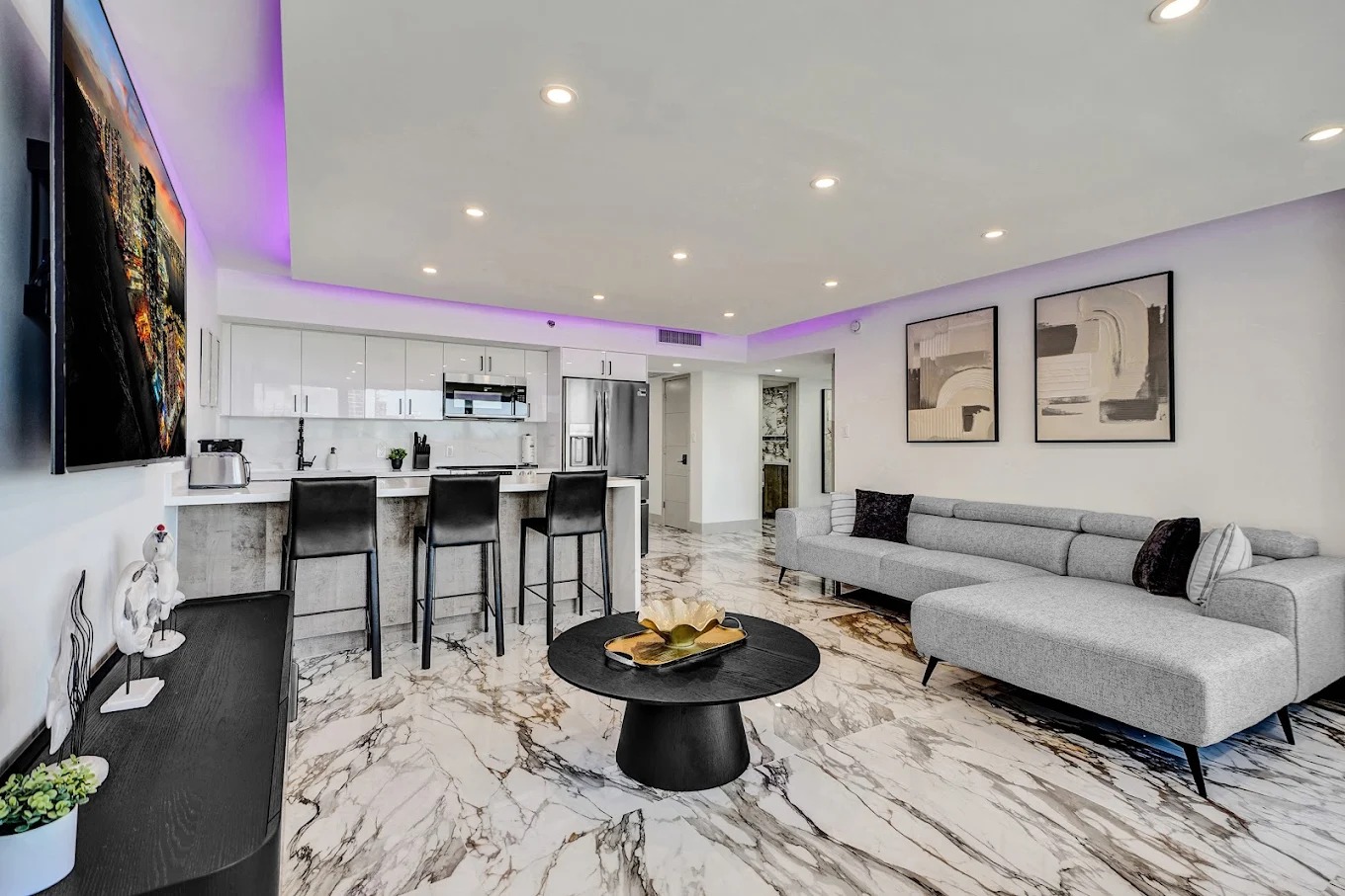 Suite living room with marble floors and ocean view
